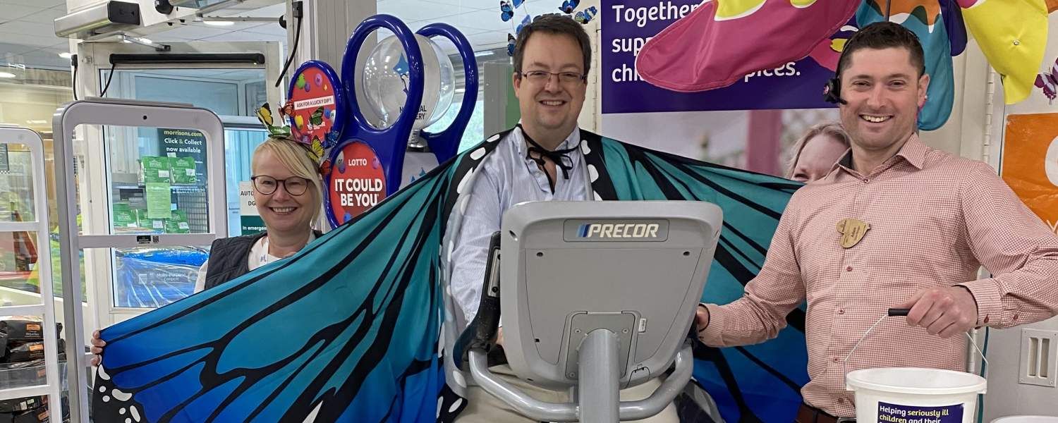 Mike Wood MP on the exercise bike at Morrisons Kingswinford to raise money for Together for Short Lives
