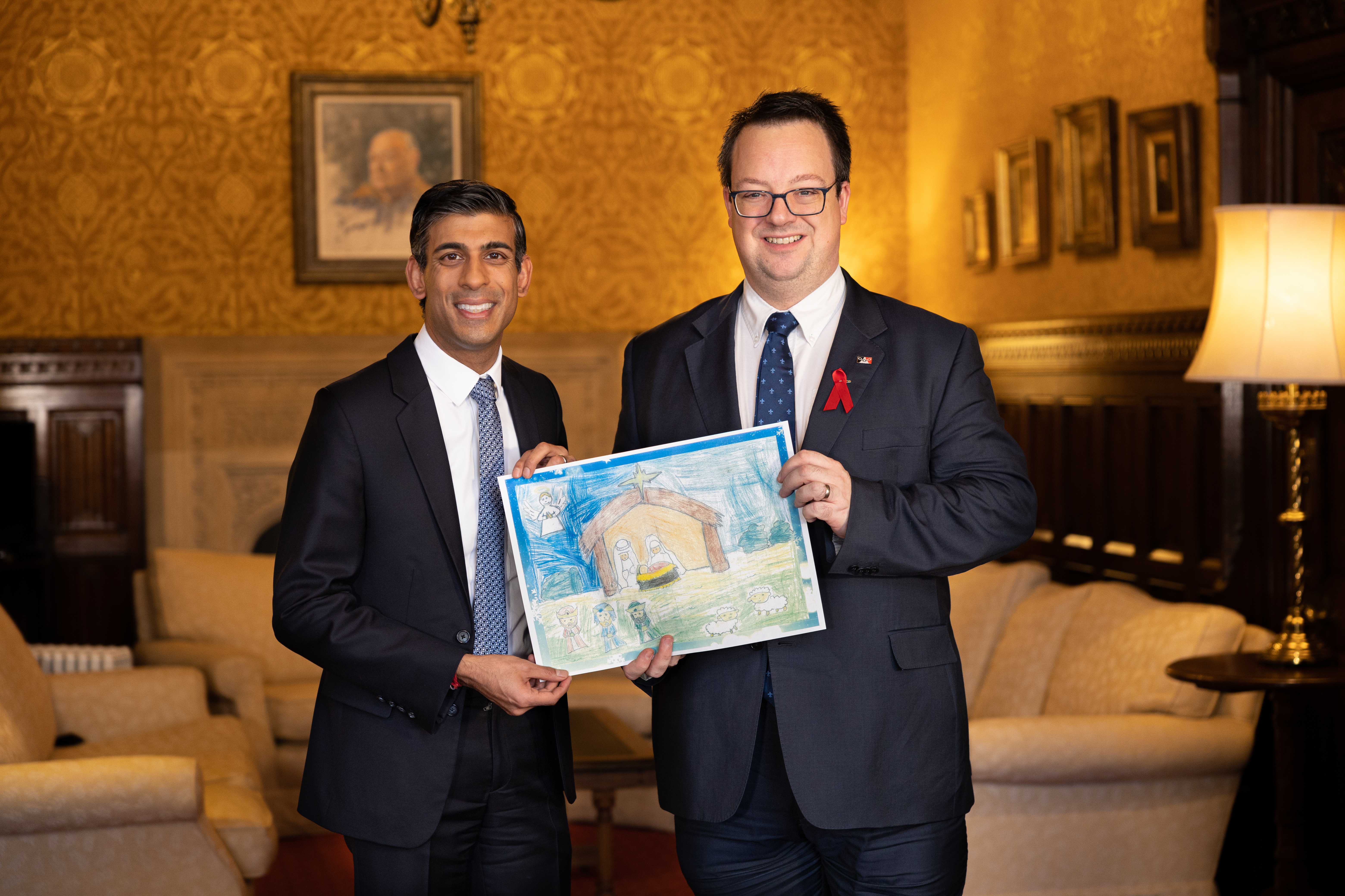 Mike Wood MP with PM Rishi Sunak holding winning entry to Mike's 2022 Christmas card competition